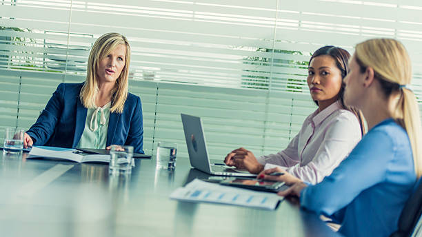 istock Businesswomen attending a meeting 584214762