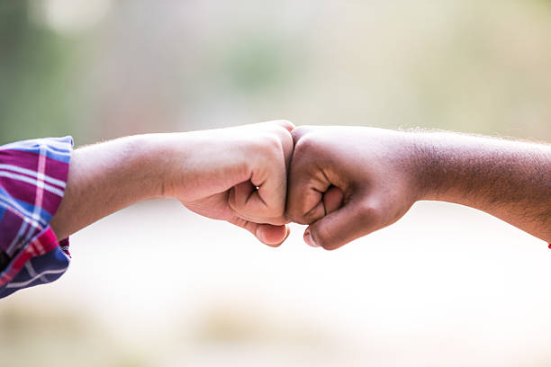 A fist bump (also called knuckle touch, power five, dap, pound, fist pound, spudding, fo' knucks, box, Bust,spuds, pound dogg, props, Bones, respect knuckles, bumping the rock, Brofist, Pound Cake, Sugar, Hooker fist, or knuckle crunching) is a gesture similar in meaning to a handshake or high five. A fist bump can also be a symbol of giving respect. It can be followed by various other hand and body gestures and may be part of a dap greeting. It is commonly used in baseball as a form of celebration with teammates, and with opposition players at the end of a game. In cricket it is a common celebratory gesture between batting partners.