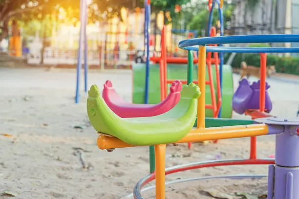 close up of roundabout plaything for kids with morning light