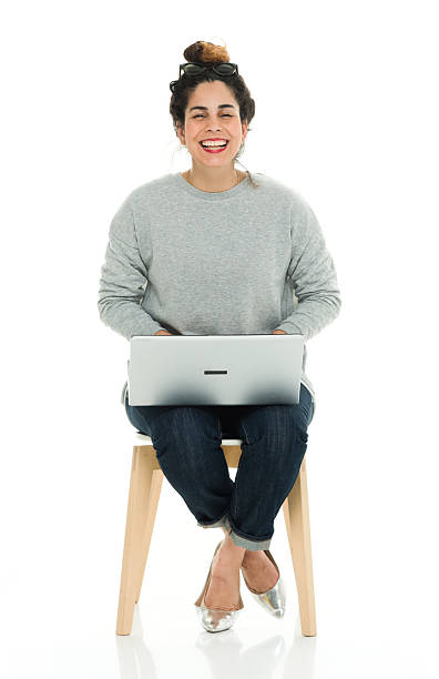 istock Cheerful woman working on laptop 584217048