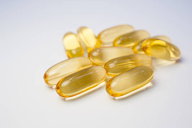 istock Omega 3 capsules from Fish Oil on white background. 584219648