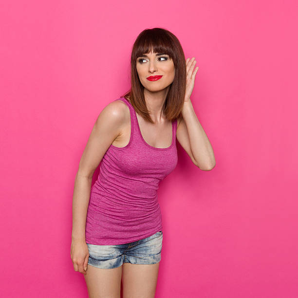 istock Eavesdroping Young Woman 584221698
