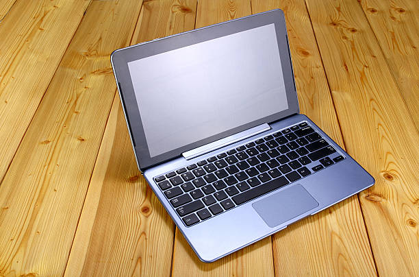 istock Laptop on wooden table 584223998