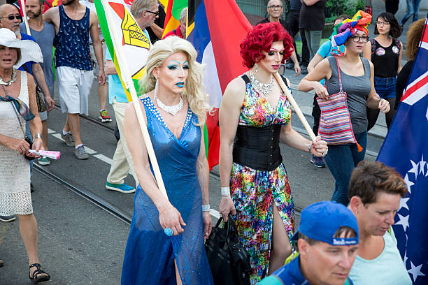 drag queens marching at pride walk, pink saturday gay europride - travesty imagens e fotografias de stock