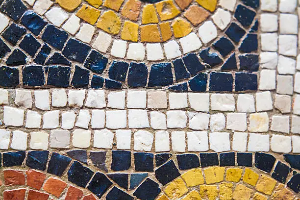 Roman polychrome mosaic with geometrical shapes. Closeup