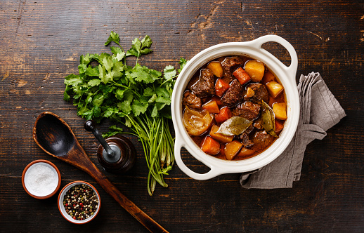 Close-up shot of authentic Indian lamb curry in a bowl on top of dining table