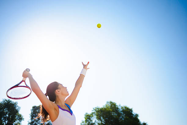 istock Young woman playing tennis. 584228512