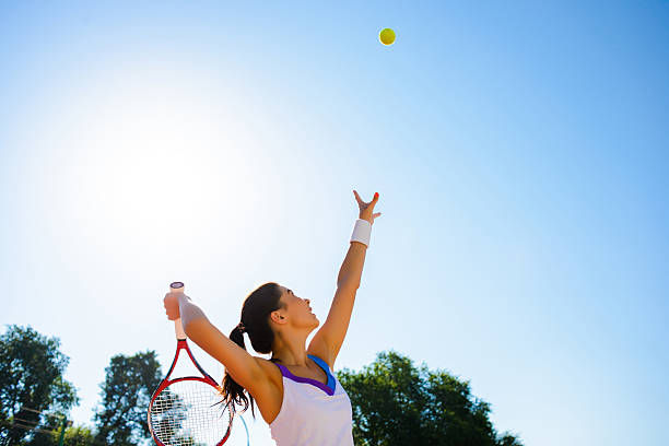 istock Young woman playing tennis. 584228914