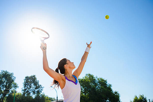 istock Young woman playing tennis. 584229120