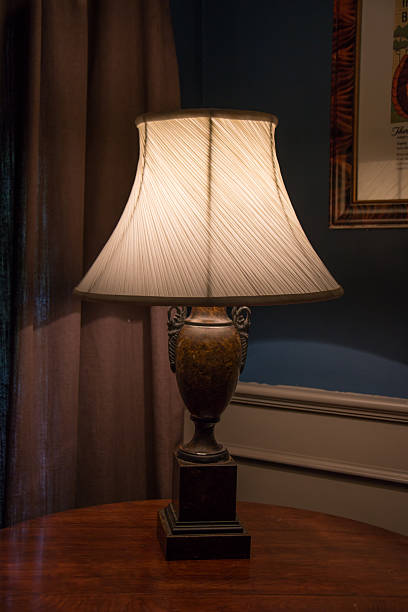 istock Vintage desk lamp on the table. 584229404
