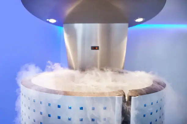 Cryotherapy capsule in cosmetology clinic. Cryo sauna for whole body cryotherapy treatment.