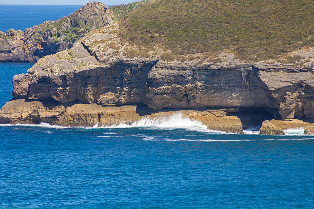 istock Coastal rocks and cliffs by the sea 584229820