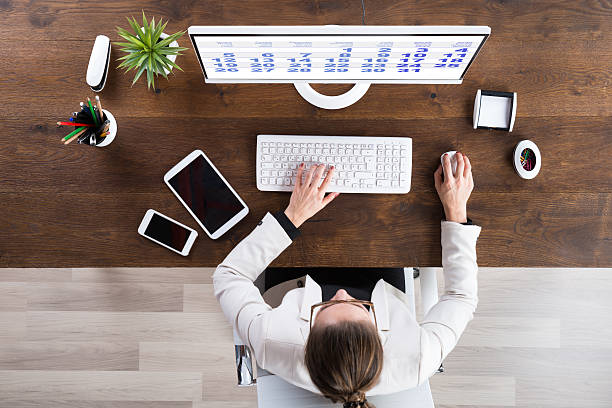istock Businesswoman Looking At Calendar On Computer 584229830