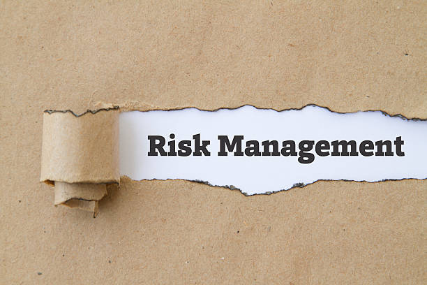 istock Risk Management written under burnt torn paper. 584229878