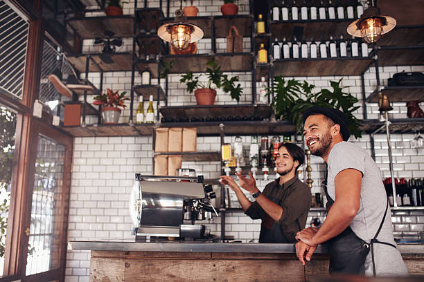 istock Coffee shop workers standing at the counter 584230358