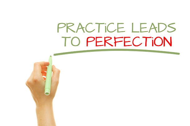 istock Hand writing Practice leads to perfection 584231220