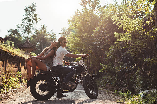 istock Young couple sitting out on a motorcycle 584231752
