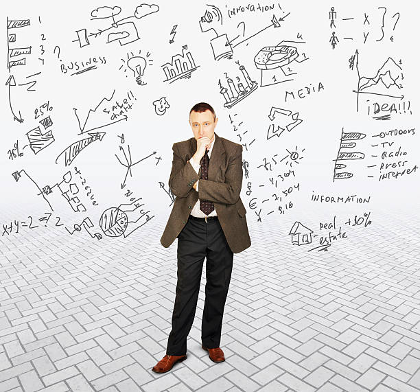 istock Serious man thinks about a lot of information 584232448