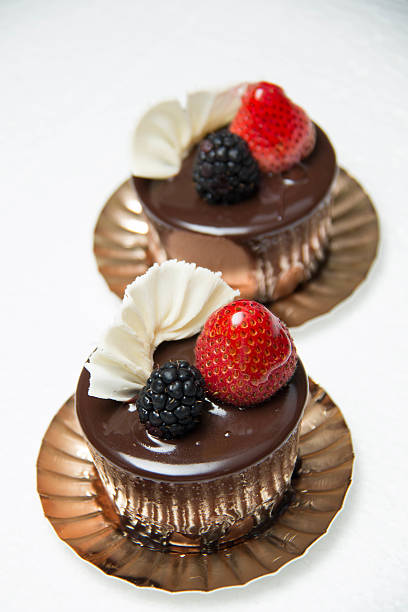 istock delicious small chocolate cake with some fruits on top 584232654