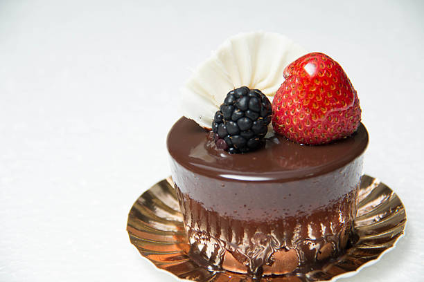 istock delicious small chocolate cake with some fruits on top 584232724