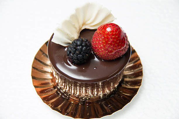 istock delicious small chocolate cake with some fruits on top 584232868