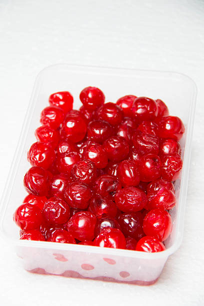 istock Sticky glace cherries, isolated on a white background 584233406