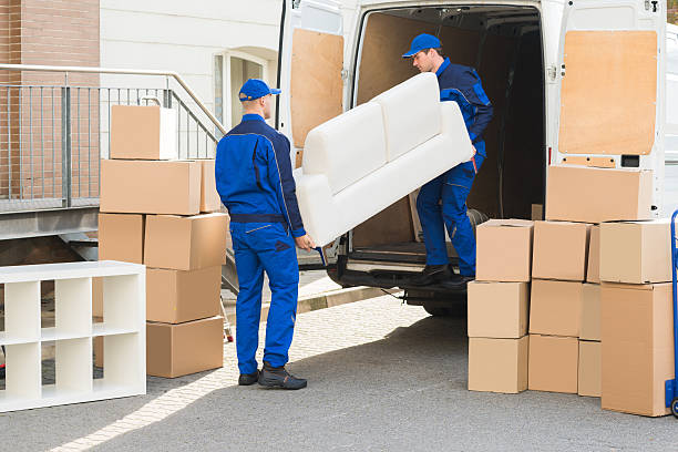 Movers Unloading Sofa From Truck Young male movers unloading sofa from truck on street moving van stock pictures, royalty-free photos & images
