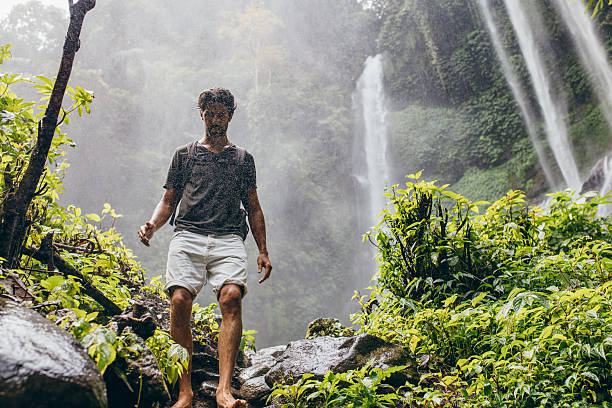 istock Male hiker walking down the mountain trail 584233880