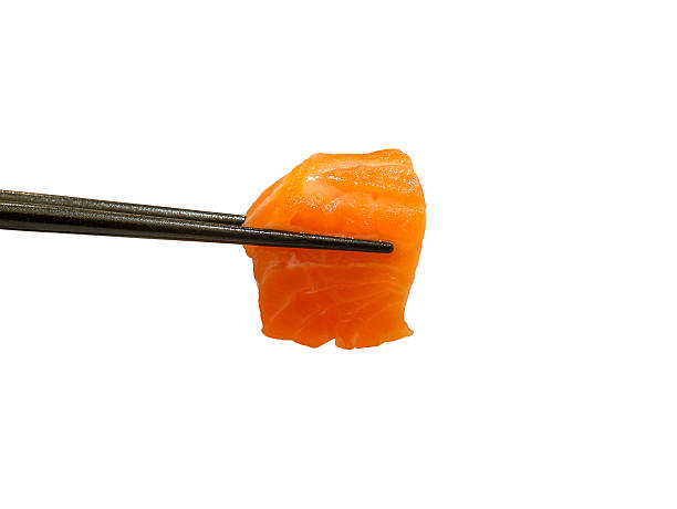 istock red salmon fish slice sashimi in chopsticks 584236144