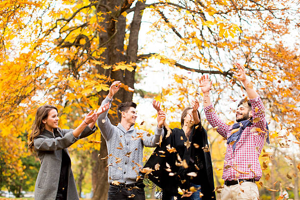 istock Young people in autumn park 584236192