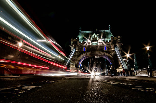 istock cars trough tower bridge by night 584240250