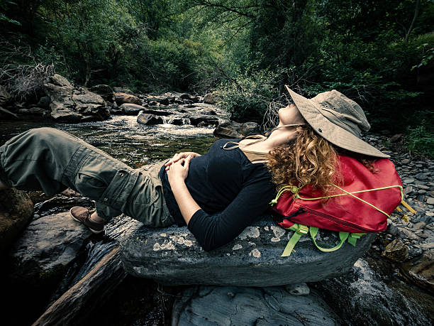 istock Taking a break in river creek during a trekking route 584241102
