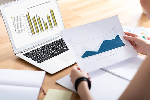 istock Woman holding paper with diagram 584242202