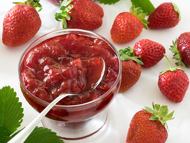 istock Strawberry jam in a glass bowl 584242350