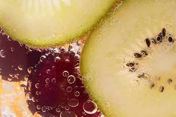 istock Cherry and kiwi in soda water with bubbles 584242572