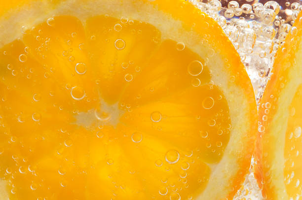 istock orange slices submerged with bubbles 584242930