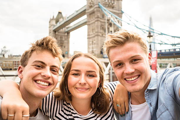 istock friends take a selfie in london - Tower bridge 584245166