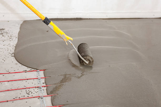 istock Electric floor heating system installation in new house. 584247104