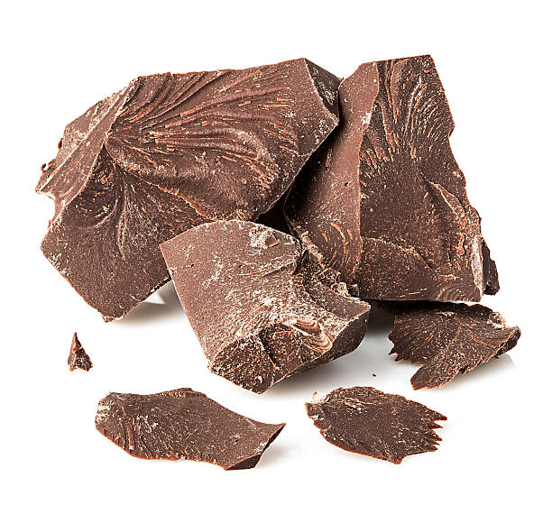 istock Chocolate pieces close-up isolated on a white background. 584247370
