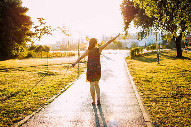 Girl walking on the sunset
