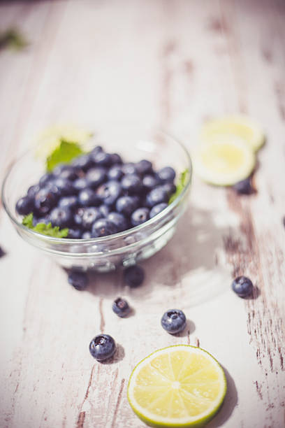 istock Juicy and fresh blueberries on rustic table. Bilberry on wooden 584248010