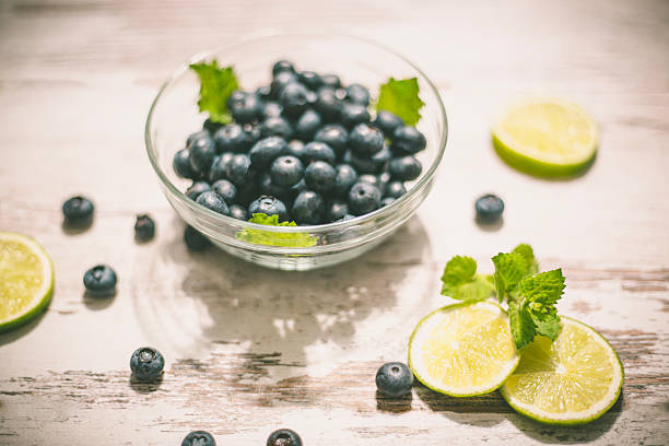 istock Juicy and fresh blueberries on rustic table. Bilberry on wooden 584248146