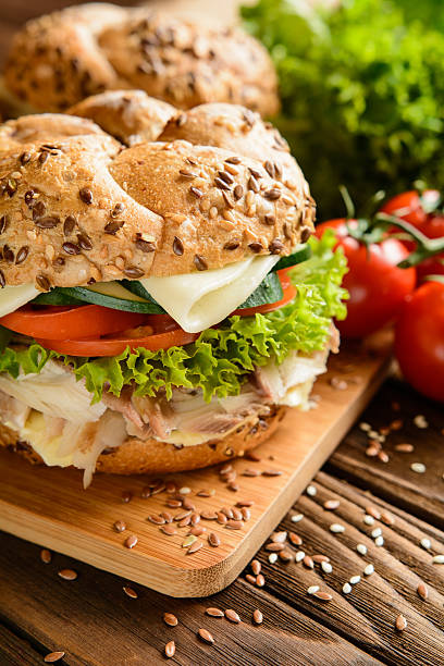 istock Fish burger with mackerel meat, cheese and fresh vegetable 584248184