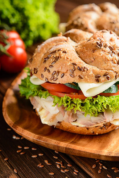 istock Fish burger with mackerel meat, cheese and fresh vegetable 584248598