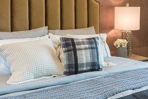 istock luxury bedroom with set of pillows on bed 584248834