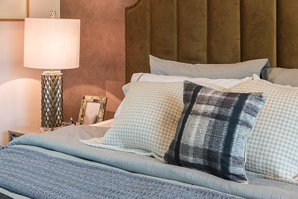 istock luxury bedroom with set of pillows on bed 584248866