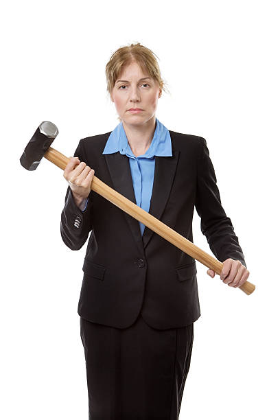 istock business woman with hammer 584249192