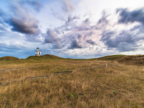 Cattle Point Lighthouse on San Juan Island, WA USA,  with large clouds.