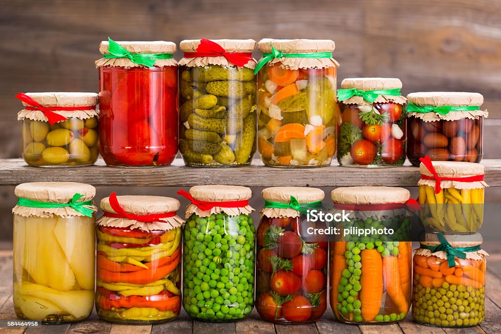 Preserved vegetables in the jars Preserved vegetables in the jars  Canned Food Stock Photo