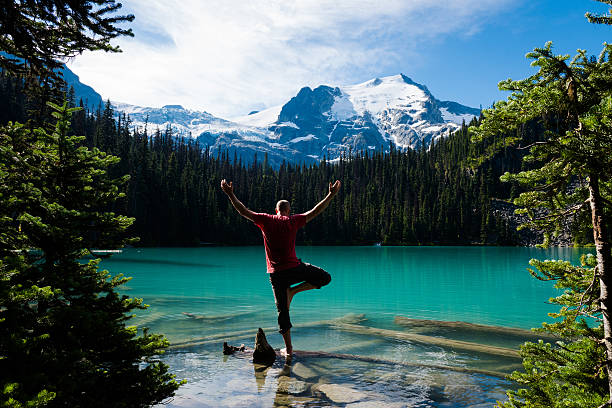 istock Man doing yoga in the mountains 584466102